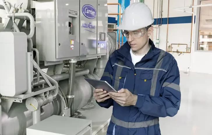 An engineer properly inspecting a HVAC system